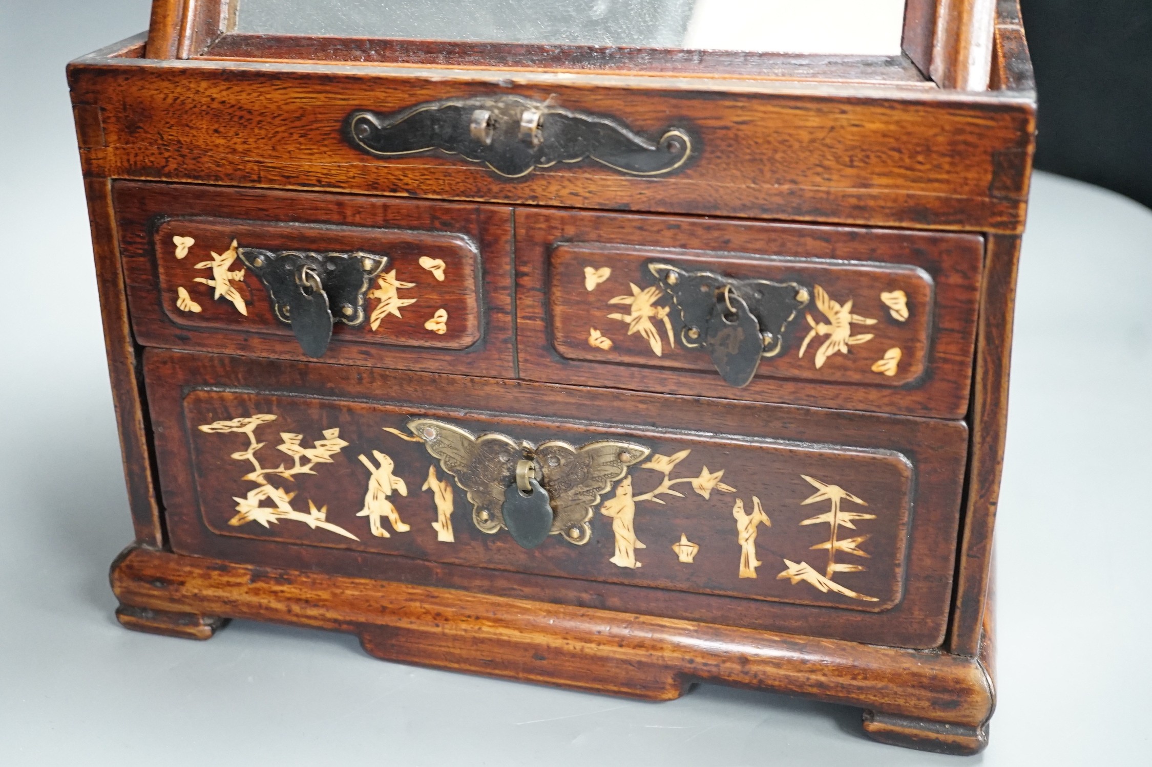 A late 19th century Chinese hardwood and bone inlaid jewellery box. 18.5cm tall